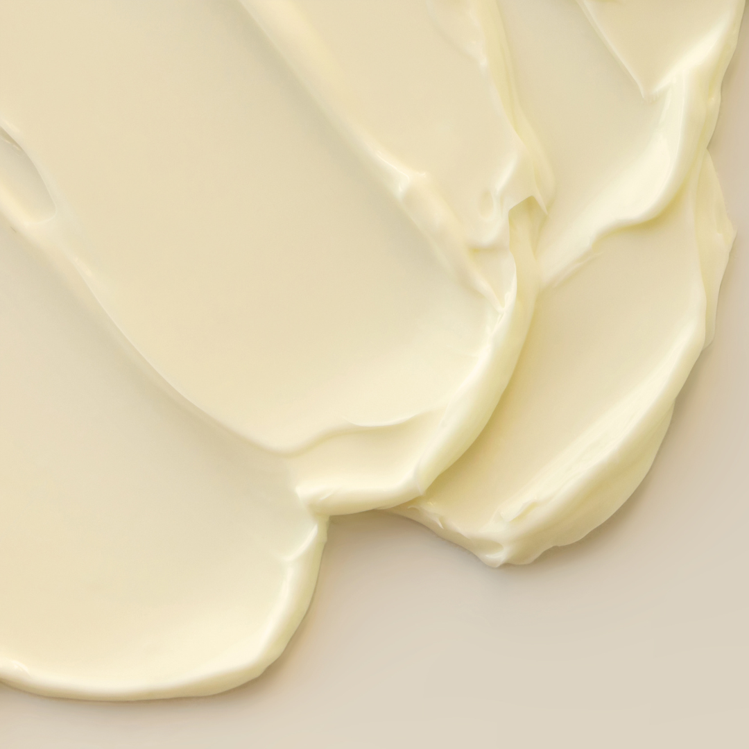 Close-up of smooth, creamy white substance on a light background
Golden Silk body butter in jar – YSL Mon Paris dupe, fruity floral scent, whipped texture
