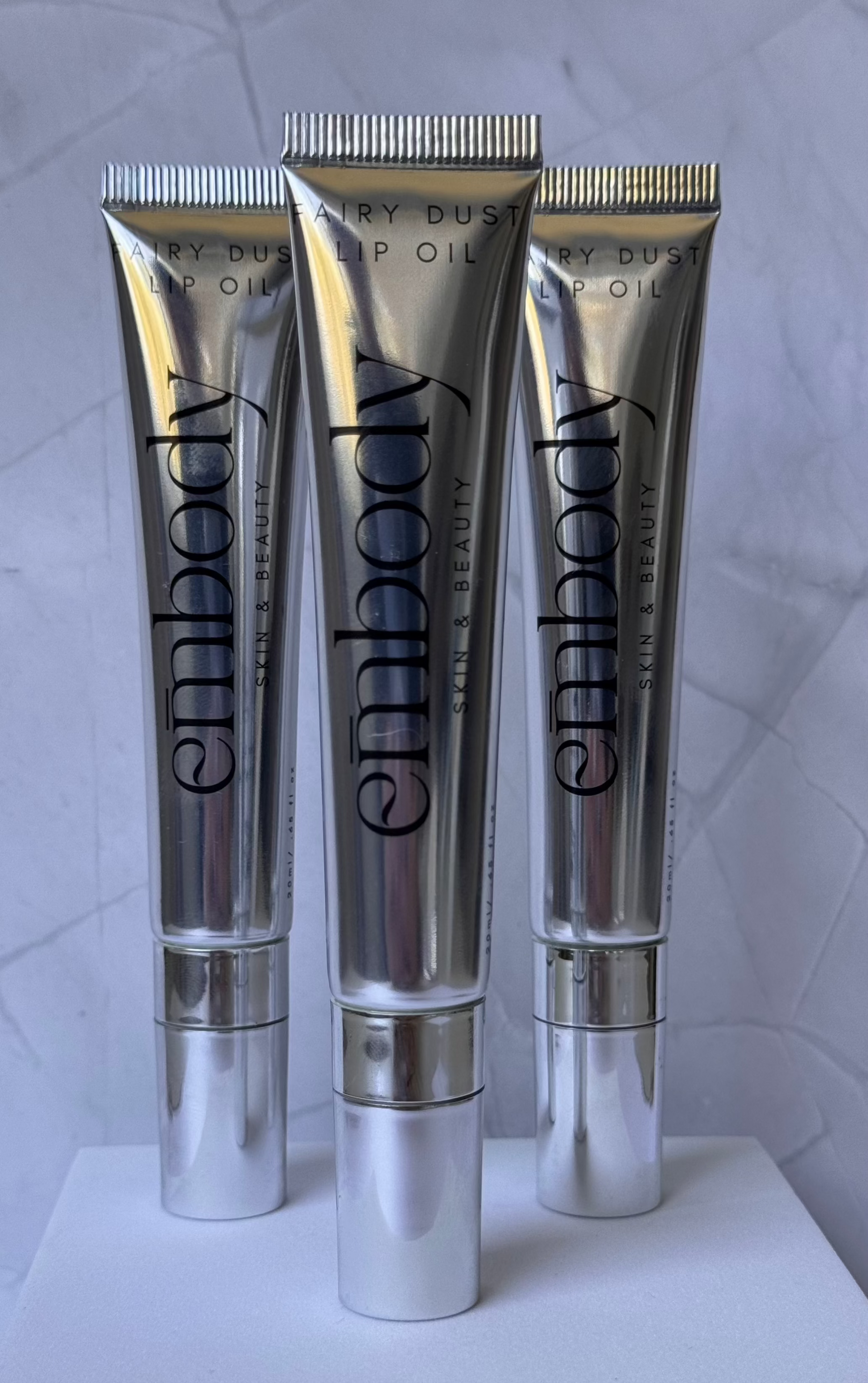 shimmer, glitter, shimmery, silver, glow, hydrated, lip oil, lip gloss, lips
